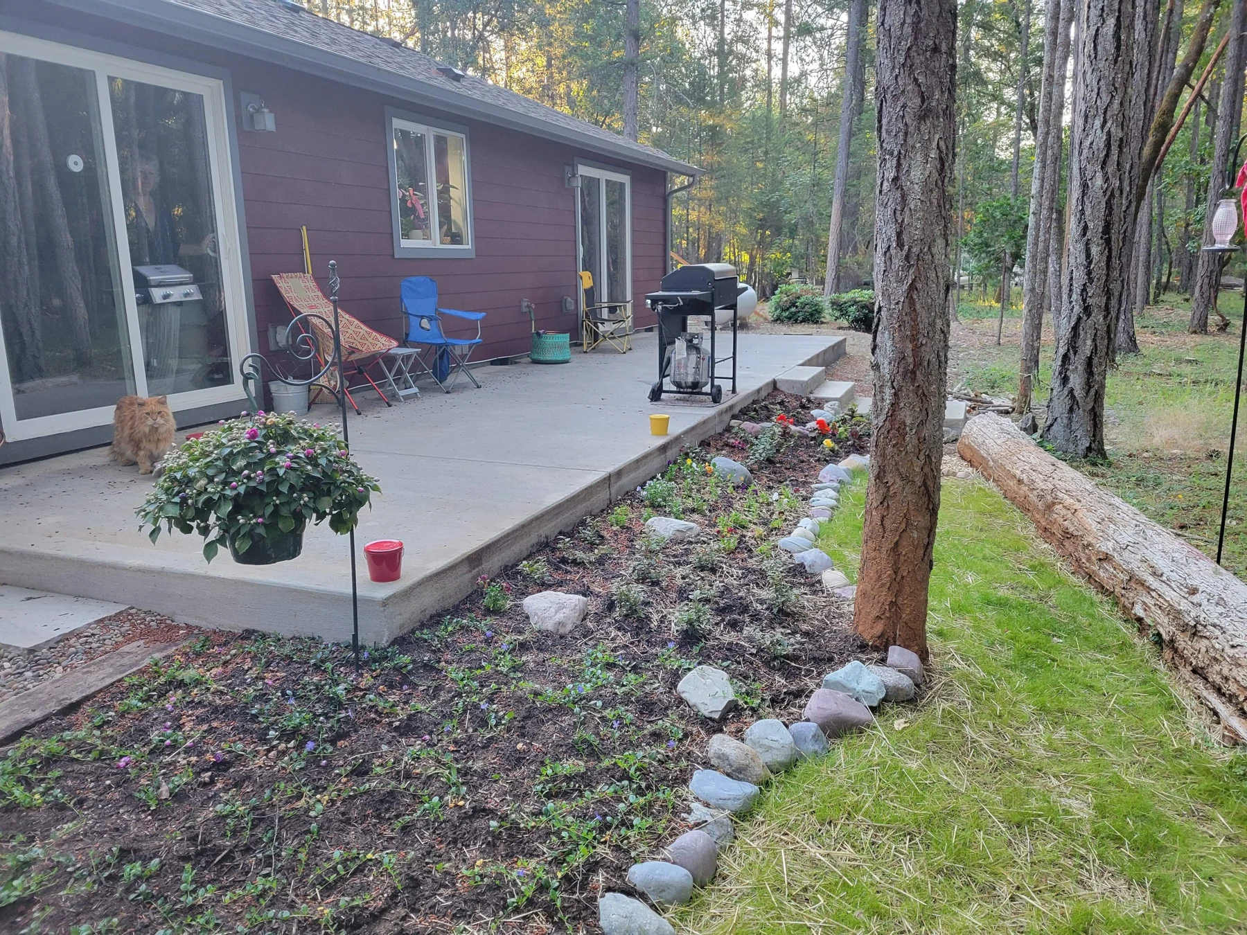 Concrete porch and walkway beside a home